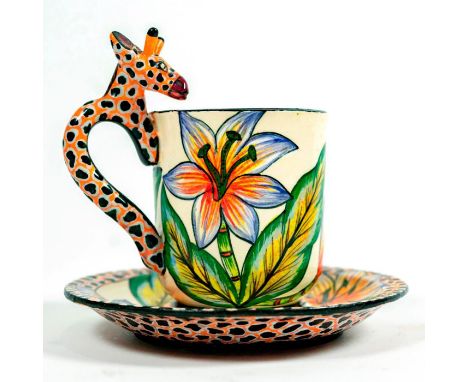 Hand sculpted and hand painted fine ceramic with giraffe handle and decorated with tropical floral designs.Sculpted by Lovemo