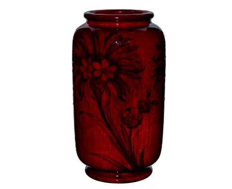 Red glaze with stylized encircling design of the Cornflower pattern; cylindrical form.Moorcroft backstamp. Light age related 