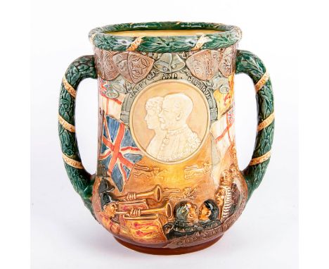 Silver Jubilee limited edition jug; Portrait medallion of the King and Queen uncrowned in relief.Surrounded by flags and trum