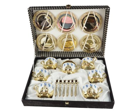 A cased set of 1960s German gilt metal mounted teacups by Kahla, including gilt metal saucers, teacups 8.5 x 7 cm excluding h