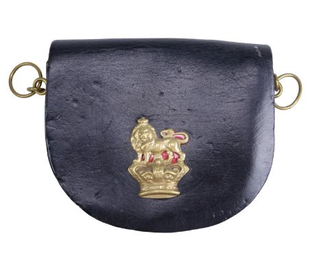 A British army cavalry shoulder belt pouch bearing a Victorian cast crown and lion badge