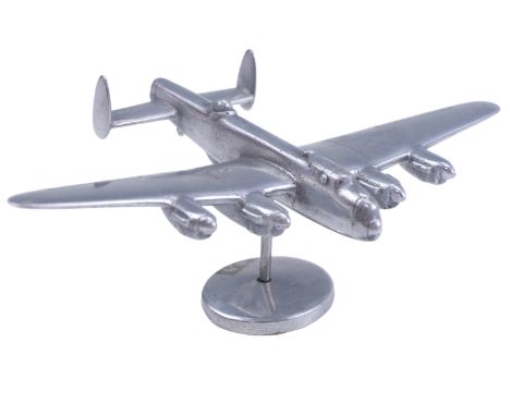 A small Second World War hand-made aluminium alloy model RAF Lancaster Bomber, inscribed P Carter, 15 cm x 5 cm high
