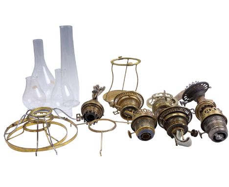 A quantity of oil lamp parts, including Hinks's Benetfink &amp; Co No 2 Duplex, Aladdin concentric burner, shade fitters, fou