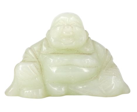 A carved jade figure of a seated Buddha, 4 cm high