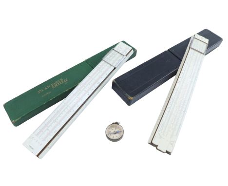 Two vintage slide rules and a pocket magnetic compass