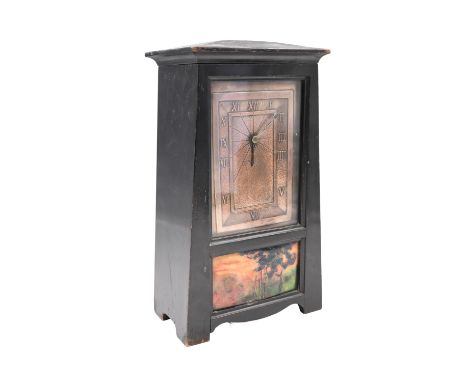 A Jugendstil copper, enamel and ebonised mantle clock, having a brass drum movement with an platform escapement, the embossed