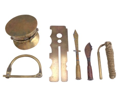 A Great War trench art cap and two letter knives, together with a button stick, a kitbag lock and pull-though