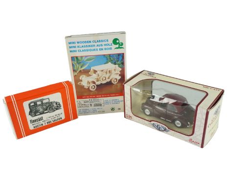 A Wills Finecast 1/43rd scale model Austin 7 box saloon metal car kit, together a Morris Minor and a miniature wooden Benz 20