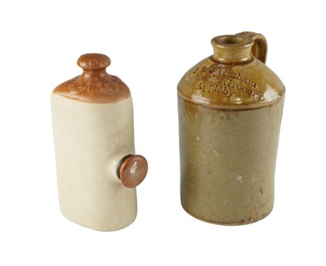 An early 20th Century stoneware flagon bearing impressed lettering 'J &amp; J Graham, Wholesale Grocers, Appleby', together w