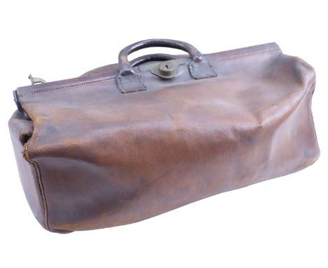 A late 19th / early 20th Century brass mounted leather Gladstone bag, bearing internal label 'Denty's Trunk Stores, 78 &amp; 