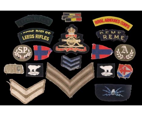 A small group of British military cloth insignia together with a Free French FNFL patch