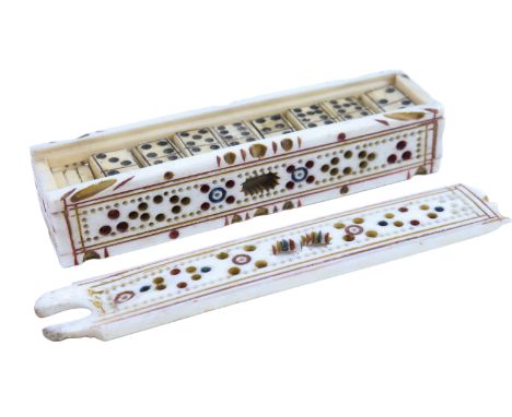A Napoleonic Prisoner-of-War work carved and painted bone "double-seven" dominoes set, its box serving as a cribbage board, 1