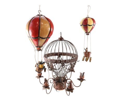 Two pendant hot air balloon ornaments together with a similar wrought metal pendant candle lamp, wrought baloon 36 x 55 cm