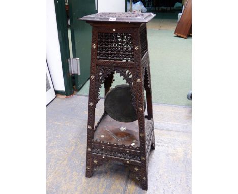 A MOORISH TWO TIER TABLE, THE TOP WITH RELIEF CARVED ROUNDEL WITHIN MOTHER OF PEARL FLOWER HEAD SPANDRELS, THE MISHRABIYE AND
