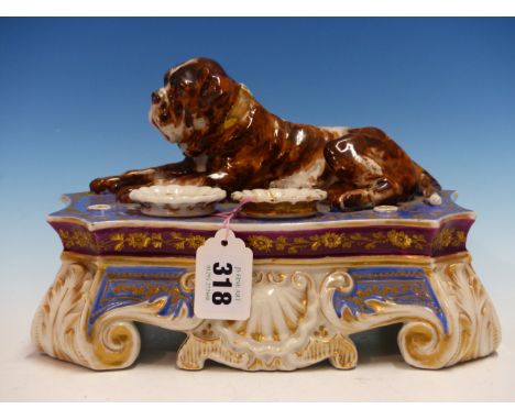 ATTRIBUTED TO JACOB PETTIT, AN INKSTAND WITH REMOVABLE SPRINKLER AND INKWELL, A BULL MASTIFF RECLINING ON THE GILT BLUE TOP A