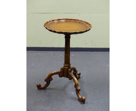 A BRASS GALLERIED MAHOGANY TWO TIER JARDINAIRE STAND THE FOUR CABRIOLE LEGS ENDING IN BRASS MOUNTED FEET. Dia 35CM . TOGETHER