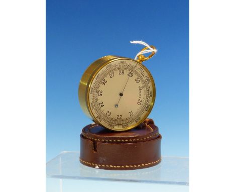 A VINTAGE AIR MINISTRY POCKET BAROMETER IN GILT BRASS CASE WITH LEATHER COVER.