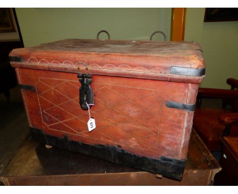 BRIGADIER FARRAN'S LEATHER TRUNK WITH IRON CLASP, HANDLES AND STRAPPED CORNERS, TWO RINGS ABOVE THE HINGES TO SECURE IT TO TR