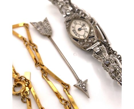 A DIAMOND SET ARROW STICK PIN. (5.7cms) TOGETHER WITH A DIAMOND AND SAPPHIRE WATCH FITTED ON A STEEL AND MARCASITE WATCH STRA