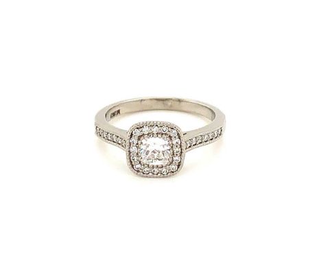 A MASTERCUT 18ct WHITE GOLD AND DIAMOND SQUARE CUSHION BRILLIANT CUT RING SURROUNDED WITH A HALO OF GRAIN SET DIAMONDS WITH D