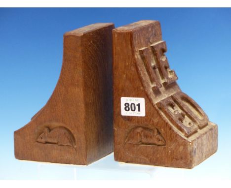 A PAIR OF MOUSEMAN OAK BOOK ENDS, THE CURVE OF ONE BRACKET SHAPE WITH M D IN RELIEF AND THE OTHER WITH I.E OVER E.D.   H 16cm