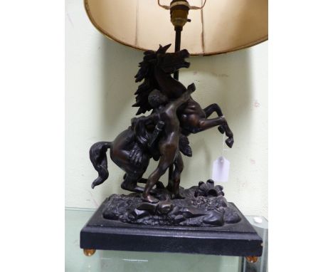 A SPELTER MARLEY HORSE SUPPORTED TABLE LAMP, THE RECTANGULAR PLINTH WITH FOUR BRASS BALL FEET.   W 26 x H 42cms. TOGETHER WIT