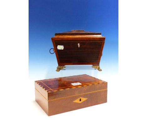 A ROSEWOOD TWO COMPARTMENT SARCOPHAGUS TEA CADDY WITH GILT METAL LION MASK AND RING HANDLES ABOVE PAW FEET.   W 22cms. TOGETH