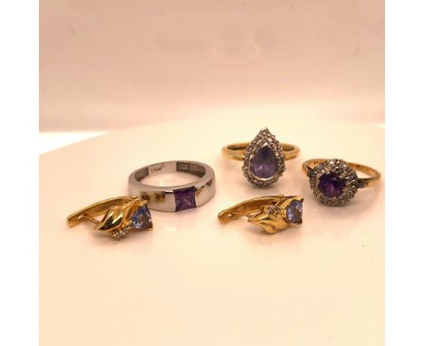 AN 18ct WHITE GOLD AND AMETHYST RING, FINGER SIZE M, TOGETHER WITH AN 18ct AMETHYST AND DIAMOND CLUSTER RING, FINGER SIZE L, 