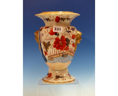 ATTRIBUTED TO MASON'S IRONSTONE, AN IMARI PALETTE BALUSTER VASE PAINTED WITH FLOWERS IN A FENCED GARDEN, THE BROWN BROAD PETA