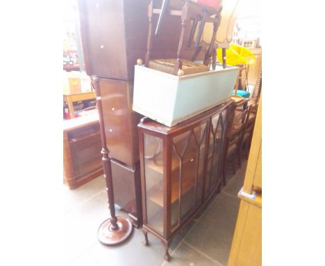 Various items of furniture; a mahogany display cabinet, a Lloyd Loom ottoman, three stools and a standard lamp. 