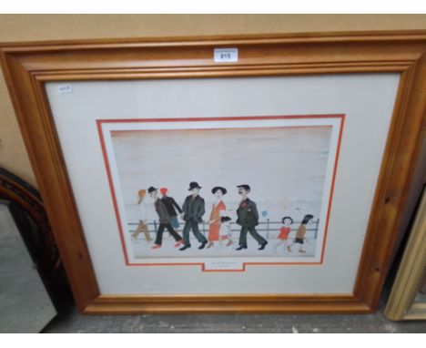A print after L S Lowry, 'On The Promenade', 40.5cm X 30.5cm, framed and glazed, 73cm X 63cm. 