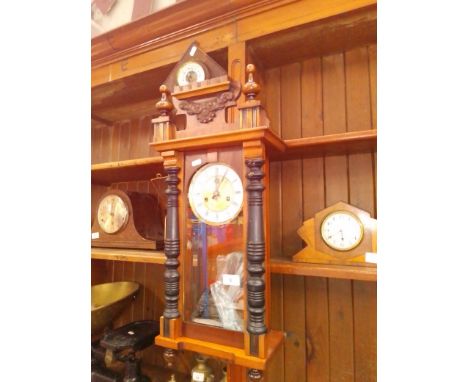 A Vienna wall clock with pendulum and key together with an early 20th century barometer. 