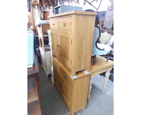 A pair of modern light oak side cabinets. 