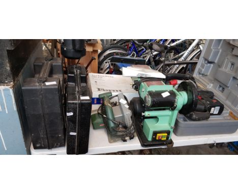 A pillar drill together with a belt sander, circular saw, rotary hammer drill, Hitachi electric drill, a grinder, a Power Dev