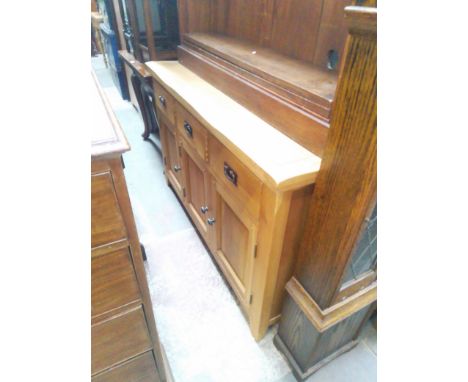 A modern light oak sideboard. 