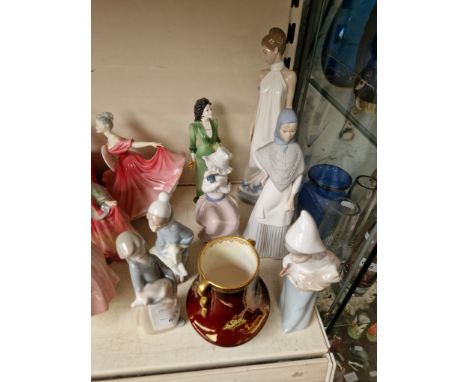 A group of ornaments to include 3 x Lladro, 2 Nao & carltonware etc.Condition:- good, crazing to carltonware piece, no sign o