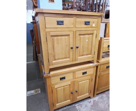 Two light oak cabinets. 