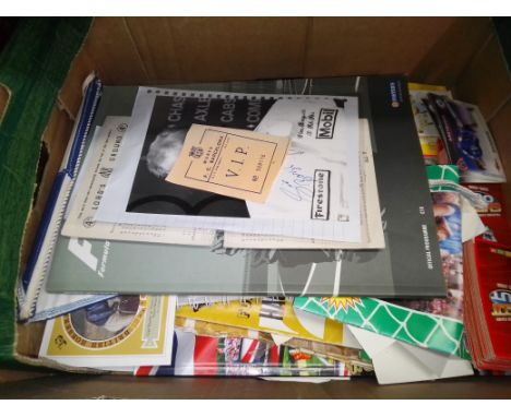 A box of mixed sporting memorabilia. 