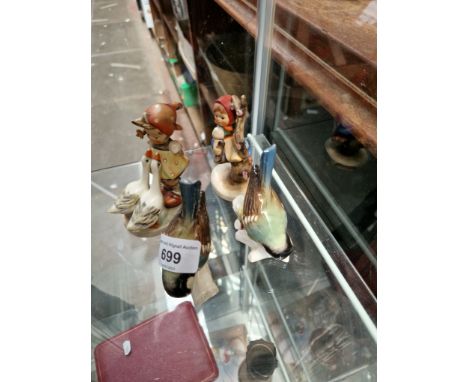 Two Goebel birds and two Hummel figures 