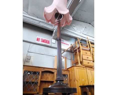 A mahogany standard lamp. 