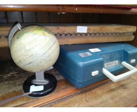 A vintage wooden German cigar press together with a vintage globe and a vintage Imperial 202 typewriter. 