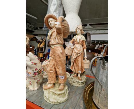 A pair of Continental ceramic figures, height lady 51cm & man 49cm.Condition:- general wear through age, man has chip to hat 