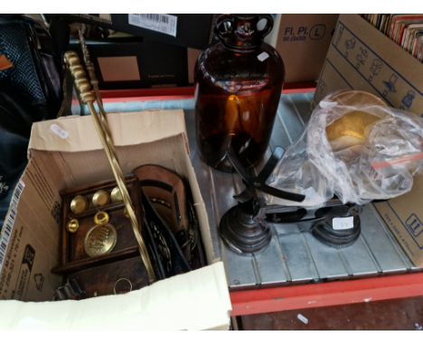 A mixed lot of metalware including horse brasses, kitchen balance scales with weights, a glass demijohn, etc. 