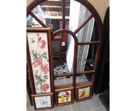 Various framed ceramic tiles and a mirror. 