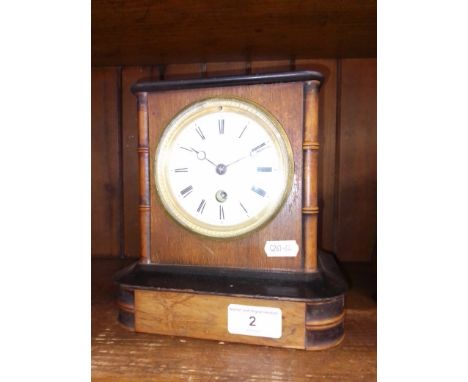 A French mantle clock with pendulum and key. 
