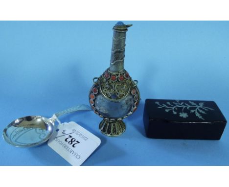 A George III silver caddy spoon, with bright cut decoration, initialled, Joseph Taylor, Birmingham 1796, a lacquered snuffbox