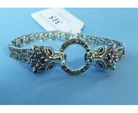 A silver, marcasite, emerald and ruby bracelet, in the form of panthers