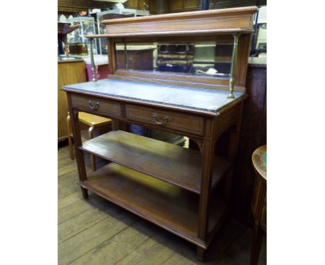 An Edwardian satinwood buffet, with a mirror back and marble top, 121 cm wide
