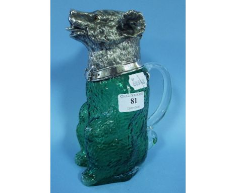 A green glass decanter, in the form of a bear, with plated metal mounts, 23 cm high