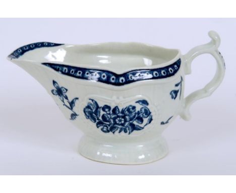 A Worcester porcelain sauce boat, decorated flowers and foliage, with blue crescent mark to base, 10.5 cm high  See illustrat